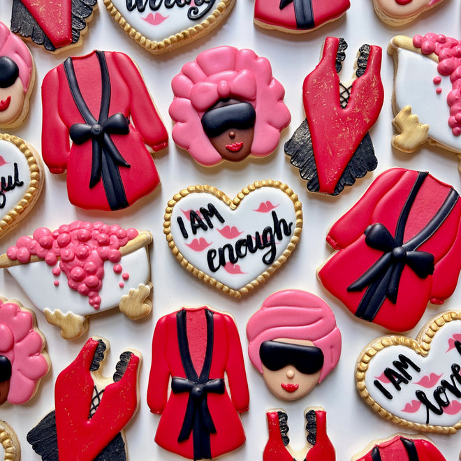 Decorative cookies with spa themed designs on a white background
